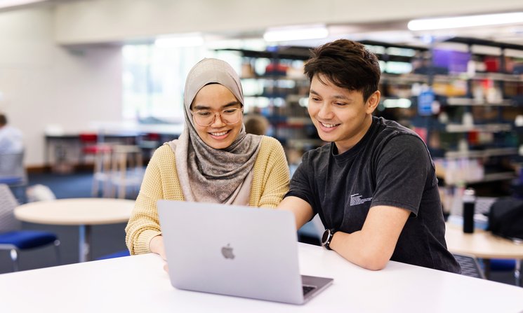 Students studying together on campus