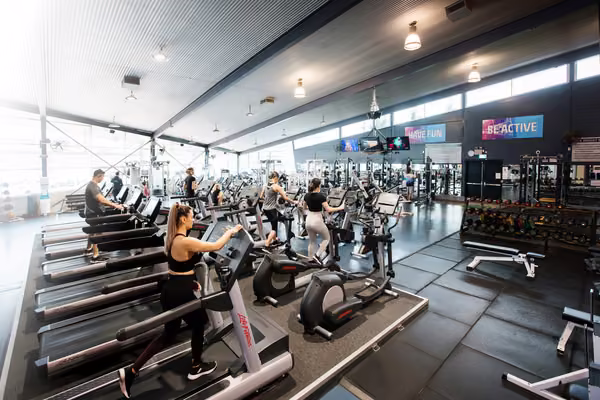 People using exercise equipment at the sport and recreation centre