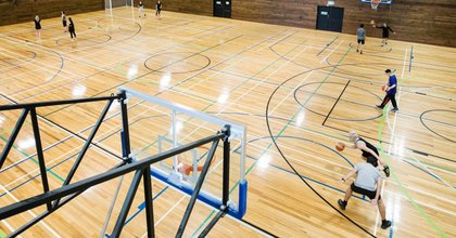 Students play indoor sports on the indoor courts