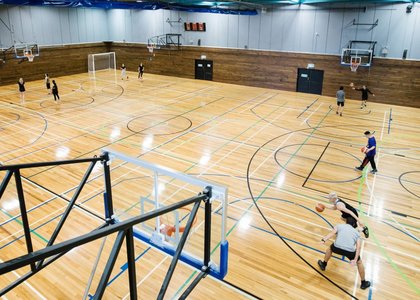 Students play indoor sports on the indoor courts
