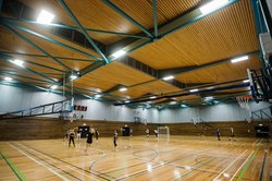 Students play indoor sports on the indoor courts