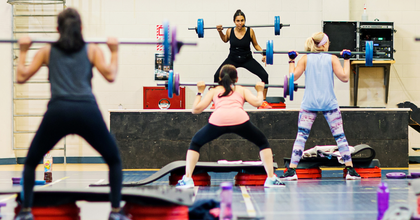 Mixed gender group fitness class in progress