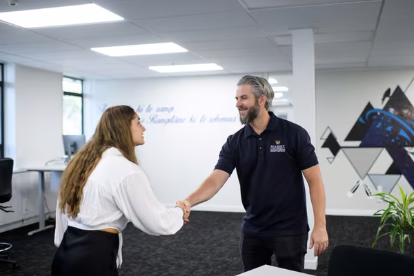 Jobs at Massey banner image - two people shaking hands