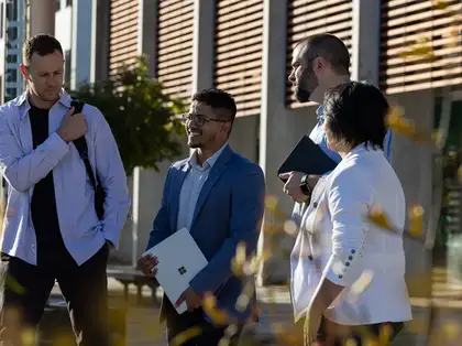 Massey business school students having discussion outside.