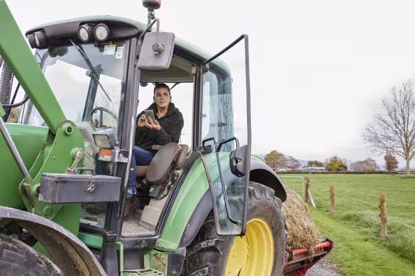 Female farmer in a tractor.