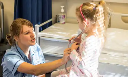 Student nurse with a young child