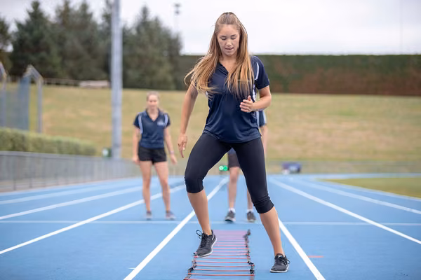Athlete using horizontal ladder on the round for fitness training