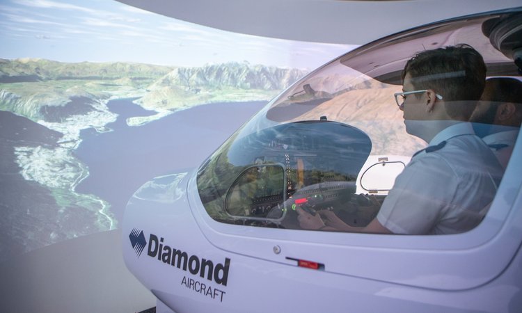 Aviation student using flight simulator