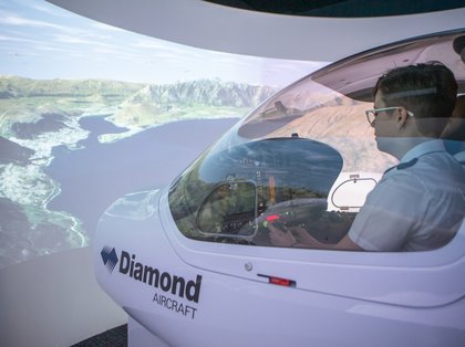 Aviation student using flight simulator