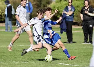 boys playing football