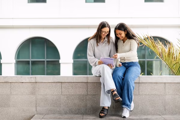 Auckland campus students studying together outside
