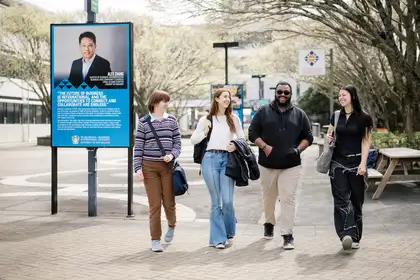 Four students walking outside on the Manawatū campus.