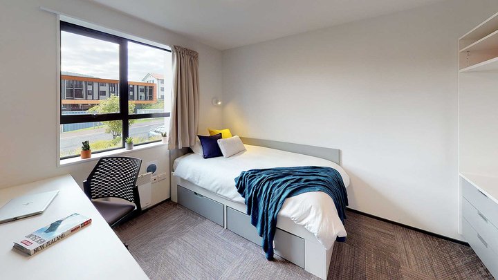 Matipo, Titoki and Tānekaha apartments' single bedroom with bed, desk and chair