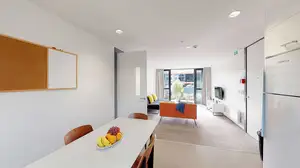 Matipo, Titoki and Tānekaha apartments' kitchen with dining table and chairs