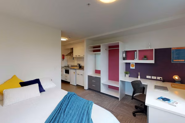 Studio Unit with double bed, study area and a kitchenette