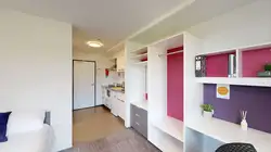 Studio Unit with bed, desk, wardrobe, and kitchenette