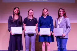 Group of awardees with their certificates