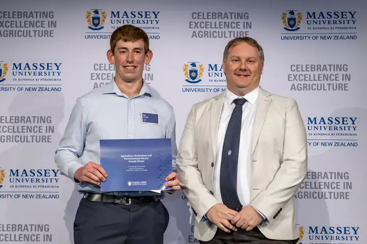 Award winner Ben Carroll holding his certificate alongside Daniel Chapman from Aviagen at the Massey Agriculture Awards.
