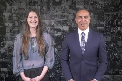 Blues Awards hosts Eliza McCartney and Dr Bevan Erueti standing together smiling.