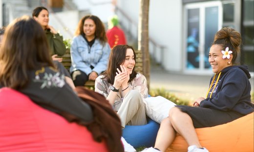 Massey students sitting outside at the Manawatū campus