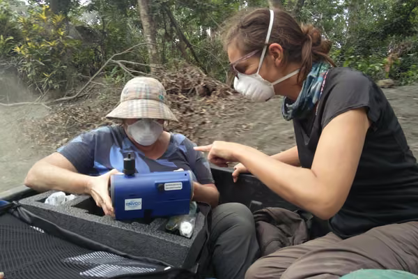 Carol Stewart (left) with Susanna Jenkins (Nanyang Technological University, Singapore) testing ash samples in Ambae, Vanuatu, in 2018, as part of an international team assessing volcanic impacts from the Ambae eruptions. (Credit Graham Leonard)
