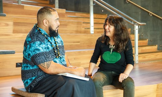 Interview and selection tile - two people having a conversation on steps