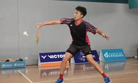 Person playing badminton