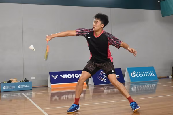 Person playing badminton