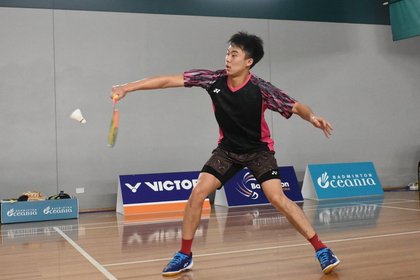 Person playing badminton