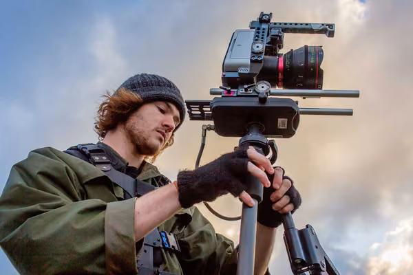 Person with a camera and tripod