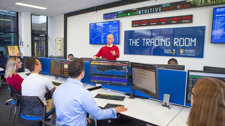 Students and teacher in the Massey University Trading Room