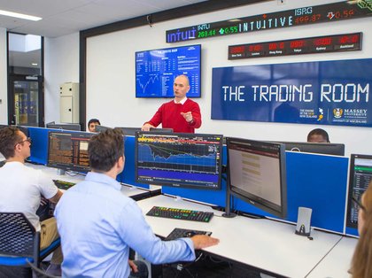 Students and teacher in the Massey University Trading Room