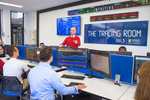 Students and teacher in the Massey University Trading Room