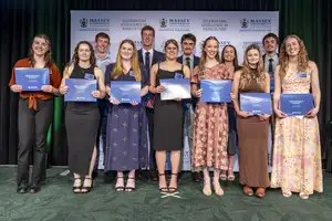 A group of first and second-year academic prize winners holding their certificates at the Massey Agriculture Awards.