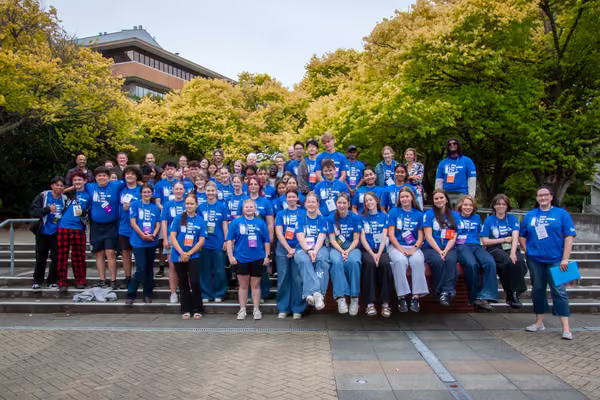 group of people wearing matching blue shirts that read food innovation youth summit