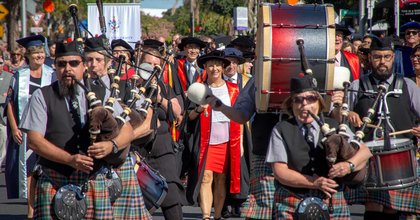 Bagpipe players leading graduation procession in Auckland