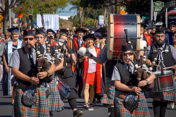 Bagpipe players leading graduation procession in Auckland