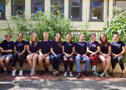 Scholars@Massey peer scholars, wearing matching navy T-shirts