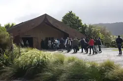 People walking into the marae for pōhiri