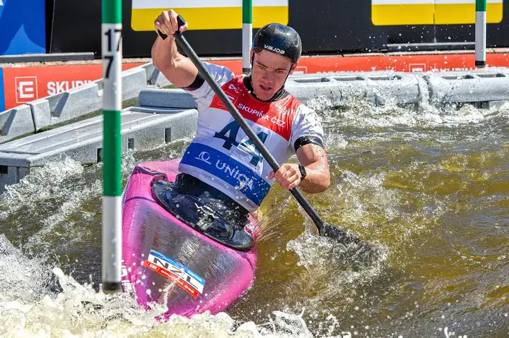 man in canoe on water