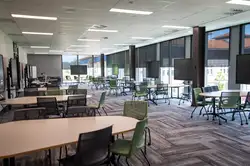 Lecture room within the Innovation Complex with seating and equipment for screen sharing.