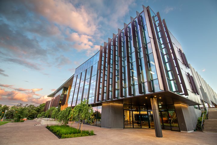 Exterior view of the Innovation Complex showing large windows and landscaping