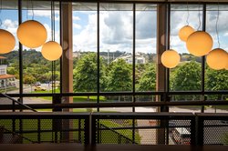 Large pendant lights hanging above the main staircase in the Innovation Complex