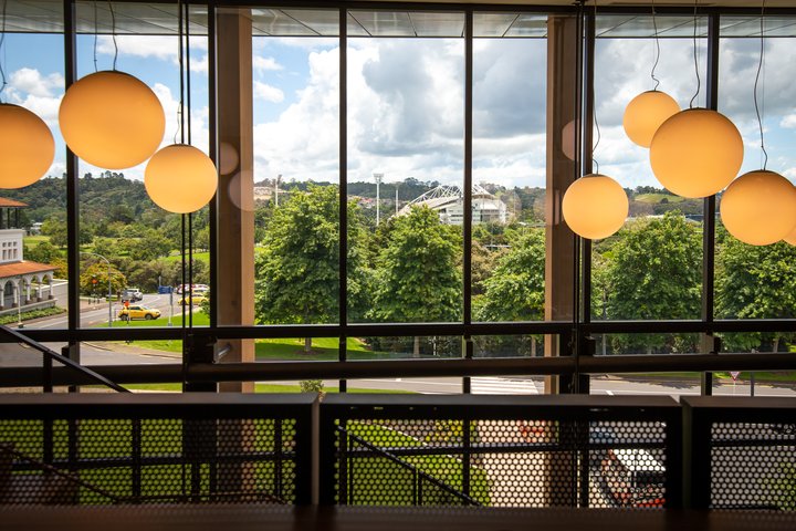 Large pendant lights hanging above the main staircase in the Innovation Complex