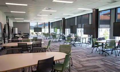 Lecture room within the Innovation Complex with seating and equipment for screen sharing.