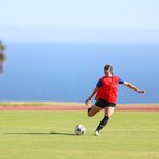 Kate Taylor, lining up to kick a soccer ball. Photo credit: Jenny Chuang