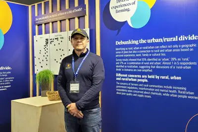 Professor Paul Kenyon standing in front of the Massey stand at the 2024 Fieldays.