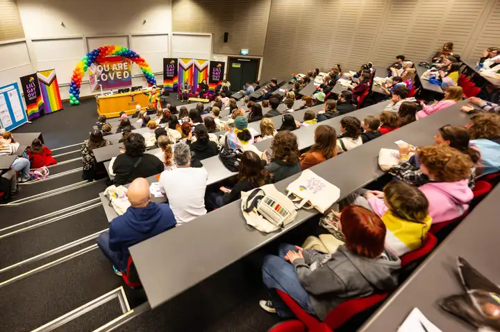 Audience sitting in a lecture theatre in Massey's Sir Neil Waters building.