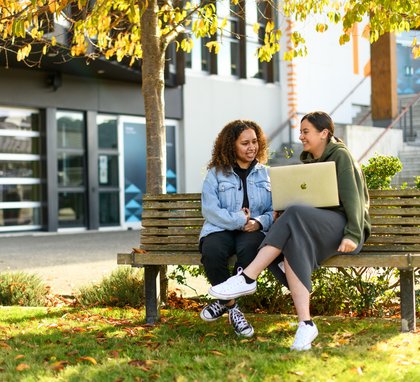 Future students chatting over a notebook computer