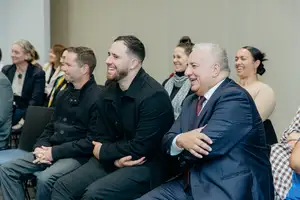 Massey staff, including Deputy Vice-Chancellor Māori Paora Ammunson, laughing during a light moment during the blessing.